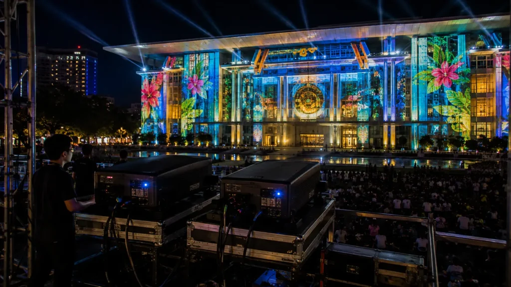 High-brightness projectors installed for outdoor building projection mapping in Malaysia.